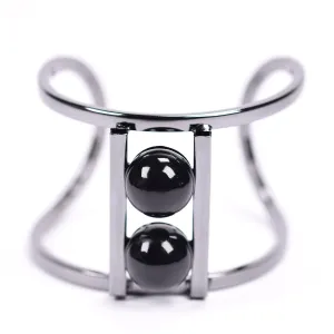 Contemporary open bangle with twin pearl feature