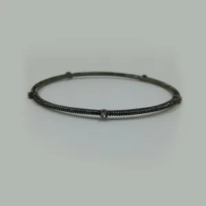 Delicate bangle w-5 interspaced set stones